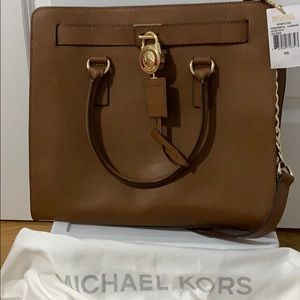 A good size of Michael Kors purse.